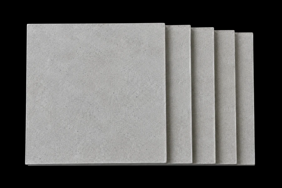 Stack of fiber cement board panels used for fire-resistant, moisture-resistant, and exterior construction applications