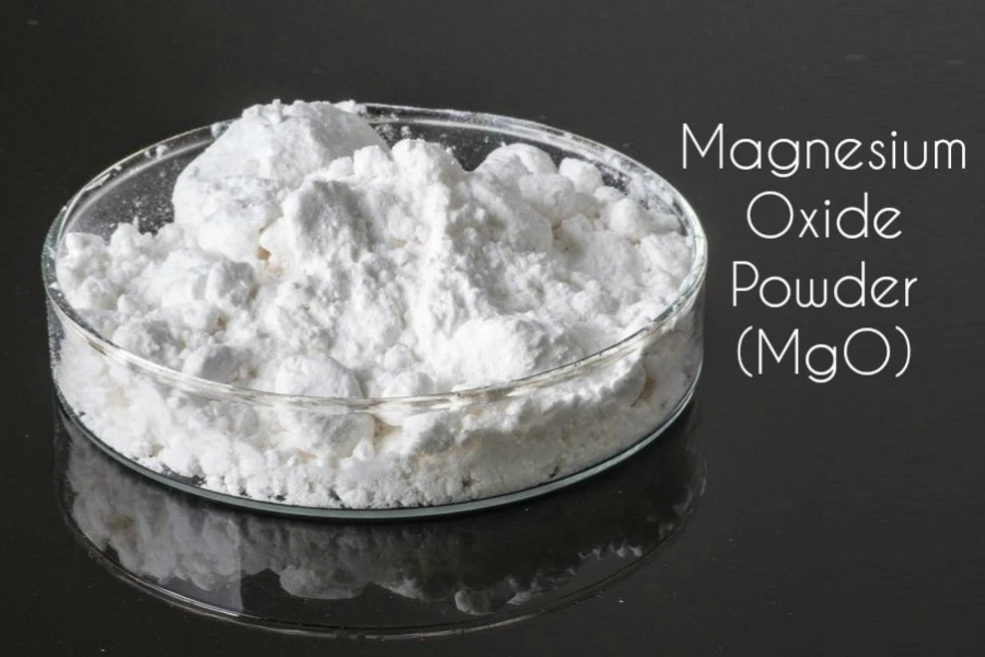 White magnesium oxide powder placed in a transparent glass container.