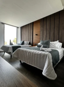 Modern hotel guest room featuring magnesium oxide board in wall and ceiling systems, providing fire resistance, durability, and a smooth interior finish.