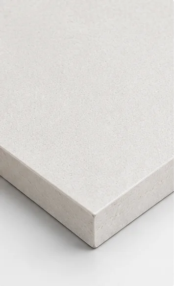 Sanded magnesium oxide board surface with a smoother finish, providing improved adhesion for laminating, coating, and decorative applications.