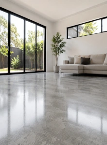 Modern interior featuring a gray finished floor installed over a magnesium oxide board subfloor, providing a stable, fire-resistant, and moisture-resistant foundation.