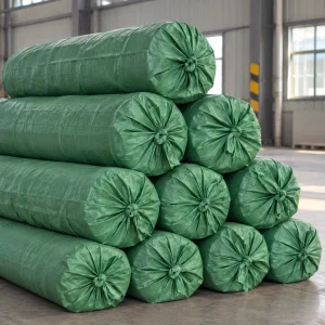 Fiberglass mesh rolls packed in green woven bags for shipment