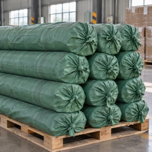 Fiberglass mesh rolls packed in woven bags and stacked on a wooden pallet